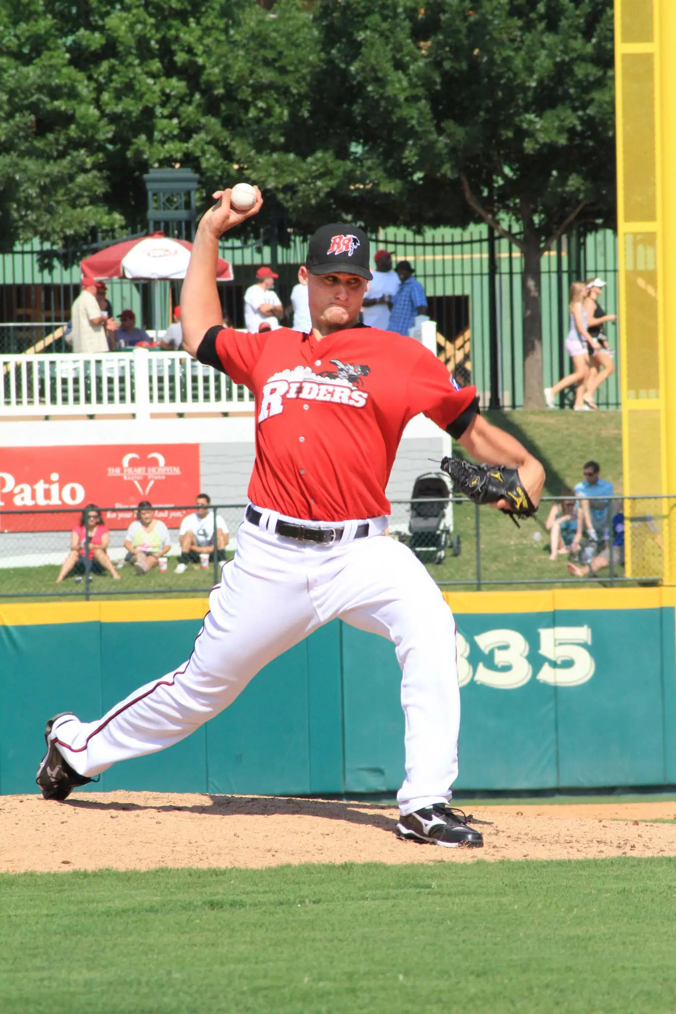 Baseball player pitching the ball