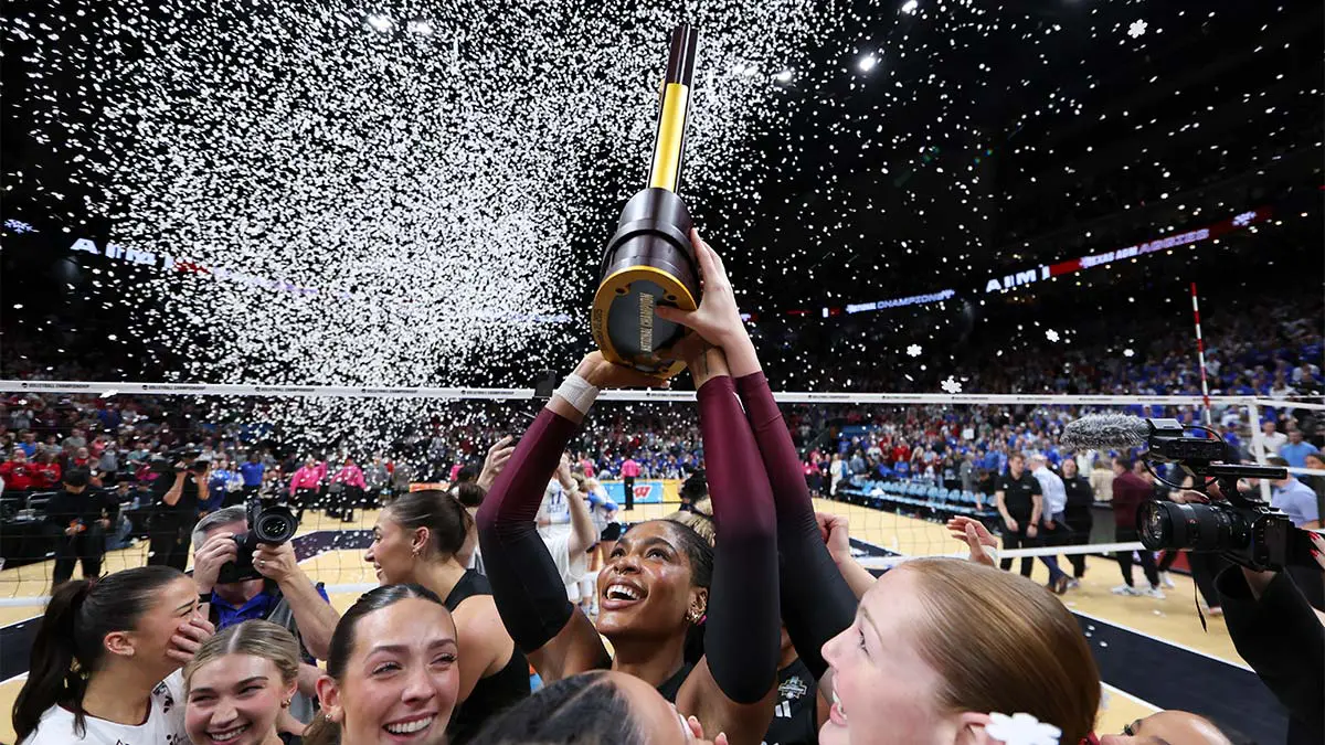 Teammates cheering with trophy